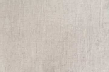 Fototapeta na wymiar Natural tissue texture as background. Linen or cotton white-gray fabric. Place for your text.