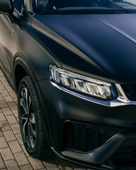 Black car headlight close up, beautiful car design