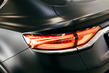 Black car headlight close up, beautiful car design