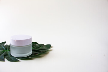 White Skincare Jar with Leaf. Organic Natural  Beauty Product. Herbal Alternative Medicine. Beauty Cosmetic.