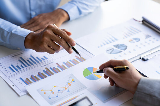 Business People Talking Discussing with concept coworker planning analyzing financial document data charts and graphs in Meetings and successful teamwork.