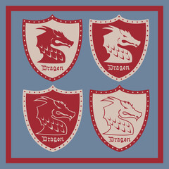 A set of shields with a dragon's head. Vector illustration