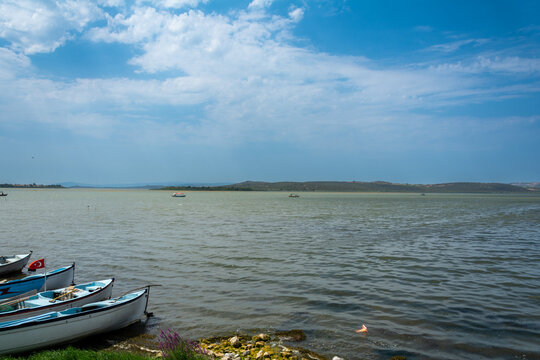 Uluabat Lake in Golyazi, Bursa, Turkey. Fisherman boats and wavy waters. 