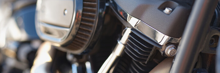 Part of a motorcycle in detail, close-up, blurry