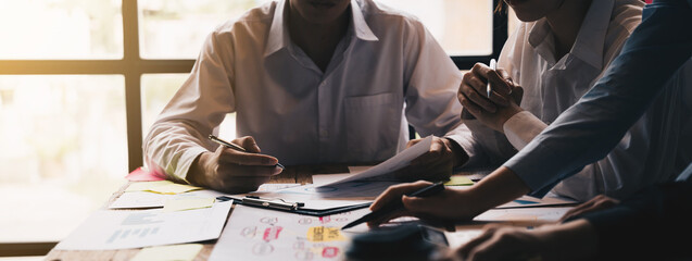 close-up of Business team point data the business plan, discussing analysis with financial data and...