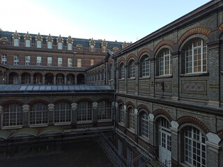 Fototapeta premium Lille, September 2022: Magnificent facades of the buildings of Lille, the capital of Flanders - Former industrial building housing the ENSAM school