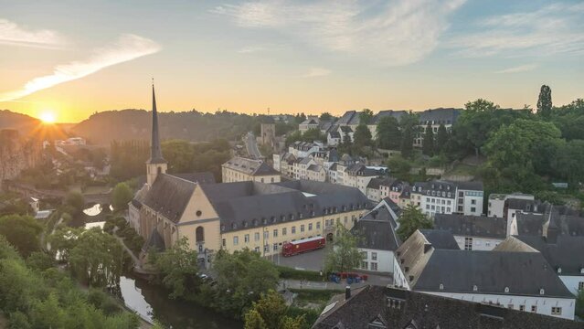 Grand Duchy of Luxembourg time lapse 4K, city skyline night to day sunrise timelapse at Grund along Alzette river in the historical old town of Luxembourg