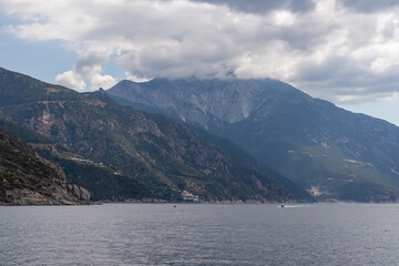 Scenic view on the cloud covered mountain peak of Mount Athos in Autonomous State of Holy Mountain, Chalkidiki, Central Macedonia, Greece, Europe. Hiking on Eastern Orthodox terrain of Again Oros