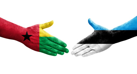 Handshake between Estonia and Guinea Bissau flags painted on hands, isolated transparent image.