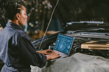 garage mechanic car engine engineer woman staff worker using laptop computer turning engine or...