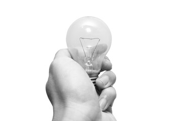 closeup black and white man hand holding old tungsten light bulb isolated on white background