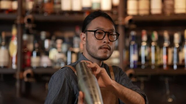 Night club concept of 4k Resolution. A bartender is making drinks for customers in a restaurant. A group of specialized clubs that sell alcoholic beverages.