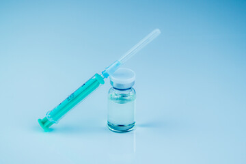  syringe with needle and vial with steroids. illegal doping in sport concept. medical items background