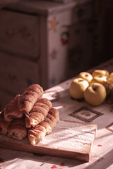 Homemade rural cakes on a wooden board in a rural atmosphere. Cake in the old kitchen