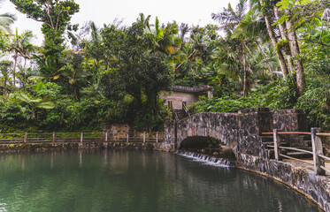 Fototapeta na wymiar Stone bridge at Bano Grande Swim area in El Yunque National Forest, Puerto Rico