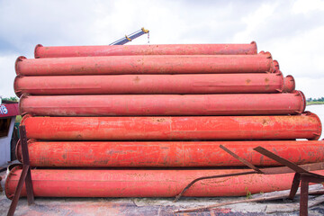 Rusted iron steel metal pipes stack an industrial field
