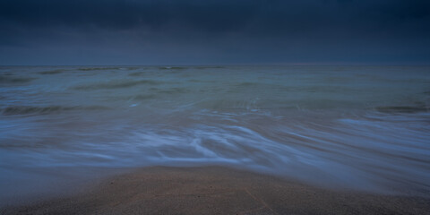 An autumn seascape waves and dark clouds