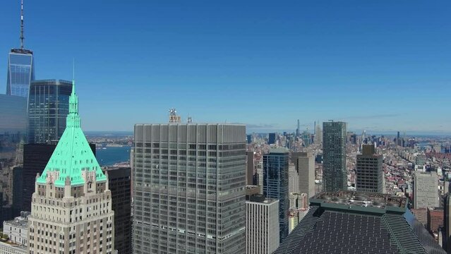 Camera goes up, starts in financial district towards Manhattan midtown view, New York.