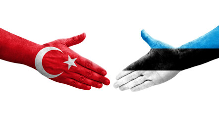 Obraz premium Handshake between Estonia and Turkey flags painted on hands, isolated transparent image.