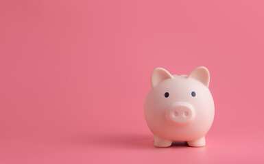 pink pig piggy bank on pink background with copy space, investment saving money wealth and...