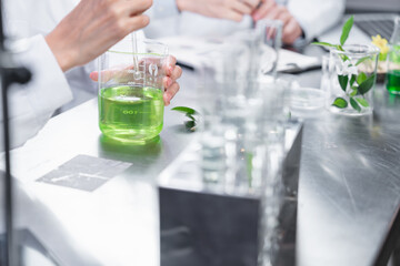 pharmaceutical science laboratory of health care cosmetic research, apothecary scientist working to test a organic herb drug of chemical medicine experiment with chemist doctor, beaker glasses tools