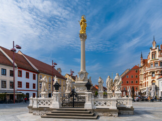 Fototapeta na wymiar the Plague Column monument and the Main Square in the historic city center of Maribor