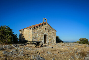 a stone chapel on a hill in the southern French town of Saint-Julian - 538639670
