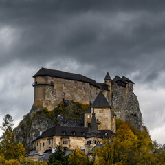Fototapeta premium view of the medieval Orava Castle in autumn under an overcast stormy sky