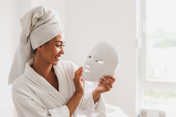 Woman Getting A Led Light Facial Mask Treatment At The Beauty Salon