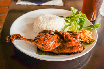 “Nasi Ayam Bakar” is a Javanese food made from grilled chicken with rice.