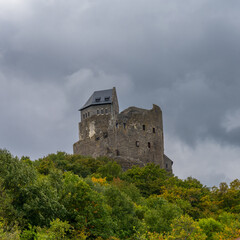 Fototapeta premium view of the 14th-century medieval castle in Holloko with green forest beneath