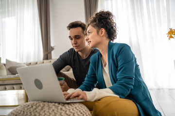 Fototapeta premium woman and man use laptop computer at home family work leisure concept
