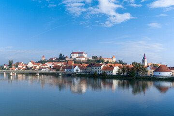 panorama cityscape of Ptuj with the hilltop castle and reflections in the Drava River