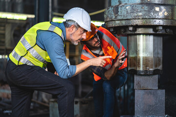 industrial factory with men at work concept, professional engineer foreman inspector talking in...