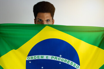 Brazilian Black Man Fan with Soccer Team Shirt Isolated on White.