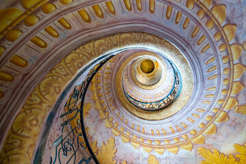 view of the multi-storey circular staircase leading from the library to the church in Melk Abbey