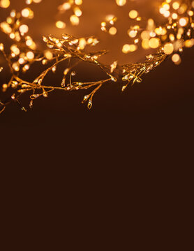 Christmas golden lights Background. Abstract twinkled bright bokeh defocused lights. Copyspace.
