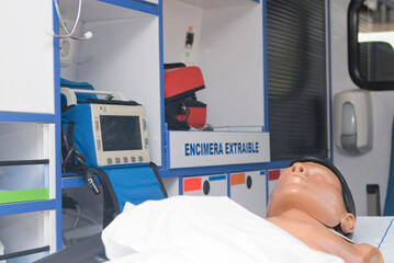 ambulance perfectly equipped with emergency equipment and dummy for first aid practices