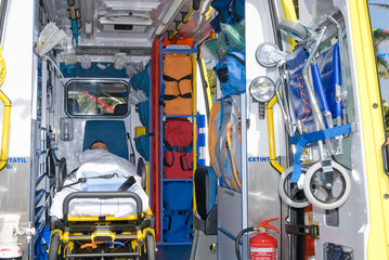 ambulance perfectly equipped with emergency equipment and dummy for first aid practices © Tandem