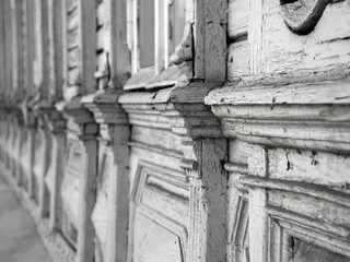 Decorative finishing of the facade of the building. Wooden trim of the frames of the old house,...