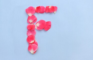 F Capital English Letter Created with Pink Rose Flower Petals on Bright Background in Horizontal Orientation, English Alphabet