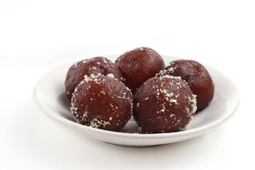 Closeup of Kala Jamun Indian Sweets in a Plate Isolated on White Background - obrazy, fototapety, plakaty