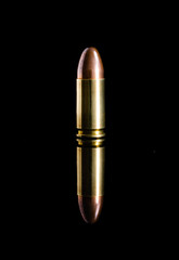 close-up 9mm bullet for a gun and reflection isolated on a black background are Suitable for...