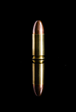 close-up 9mm bullet for a gun and reflection isolated on a black background are Suitable for creative graphic design.