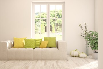 Minimalist living room in white color with sofa and summer landscape in window. Scandinavian interior design. 3D illustration