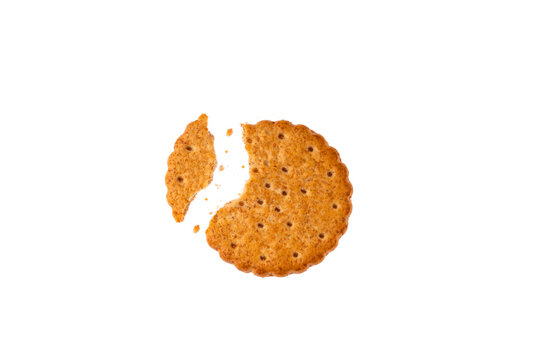 wholemeal biscuit with a bite and crumbs isolated on white background text space format or photo in png