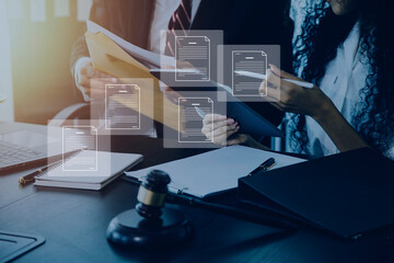 Business and lawyers discussing contract papers with brass scale on desk in office. Law, legal services, advice, justice and law concept picture with film grain effect