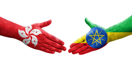 Handshake between Ethiopia and Hong Kong flags painted on hands, isolated transparent image.