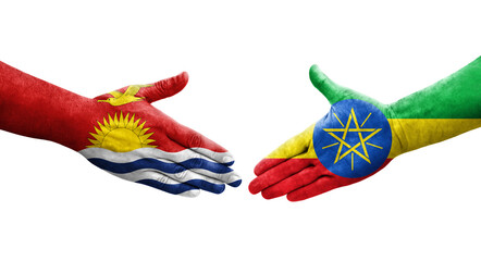 Handshake between Ethiopia and Kiribati flags painted on hands, isolated transparent image.