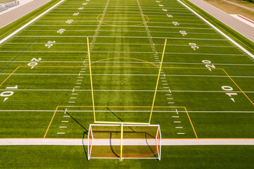 Soccer field top straight down aerial shot. Empty football playground. Sport stadium green grass and white paint lines and marks for games and activity. Healthy lifestyle. - 538658253